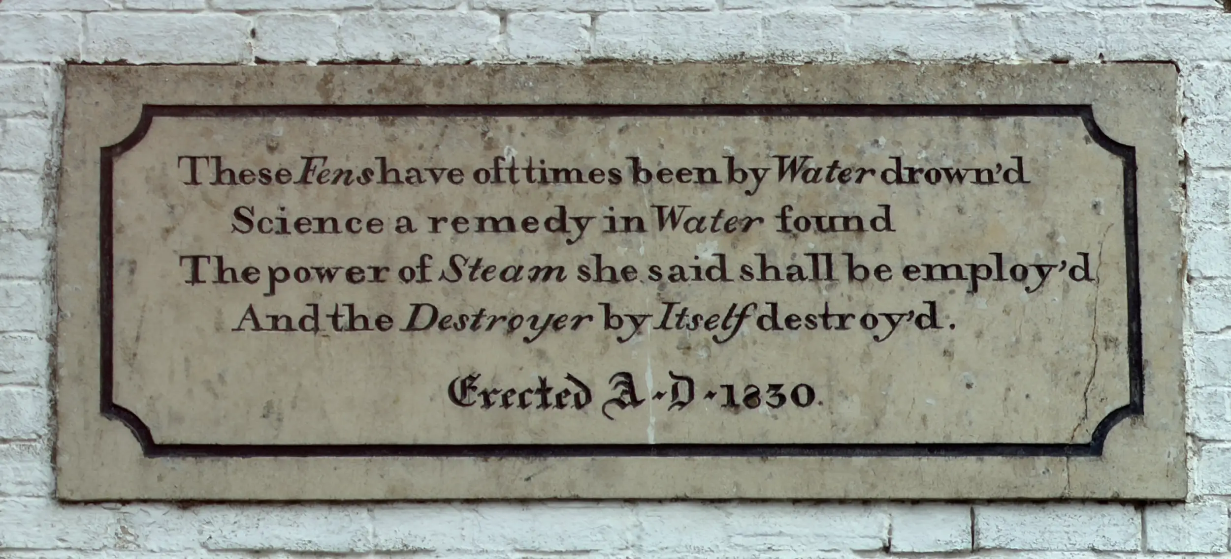 Stone plaque bearing William Harrison’s 1830 verse about Fenland flooding and steam power